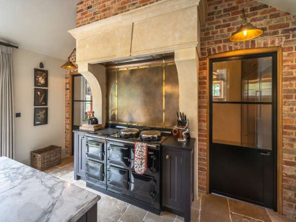 Custom-Made Copper and Brass Cooker Splashback with Integrated Extractor