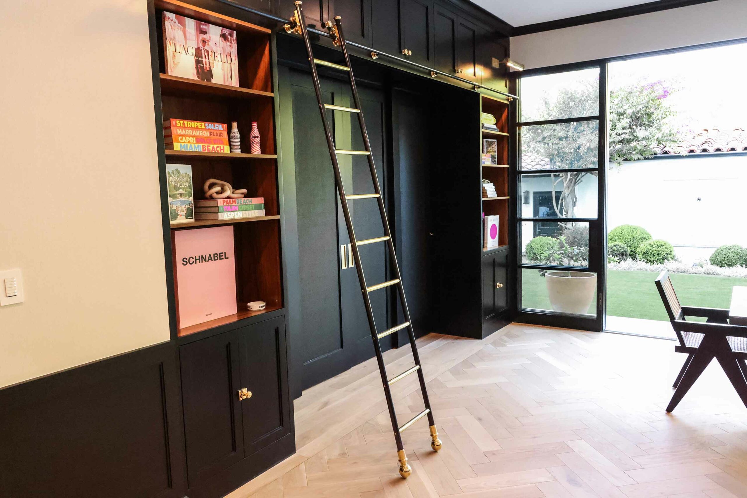 Custom-made brass and steel rolling library ladder by Andrew Nebbett Designs